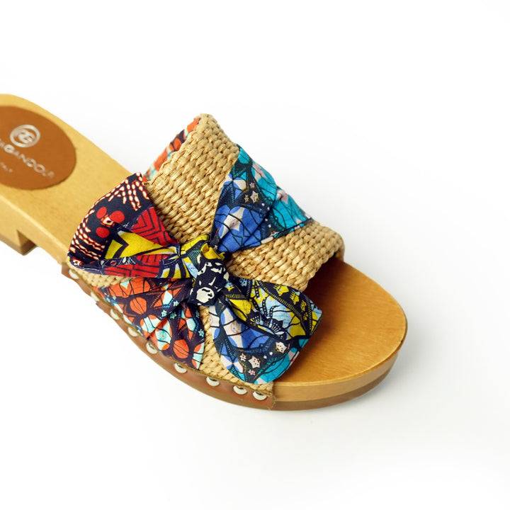 Roberta Gandolfi Lola Sabot sandali in legno con rafia e pelle di vitello con fiocco stampa african Vendita Calda